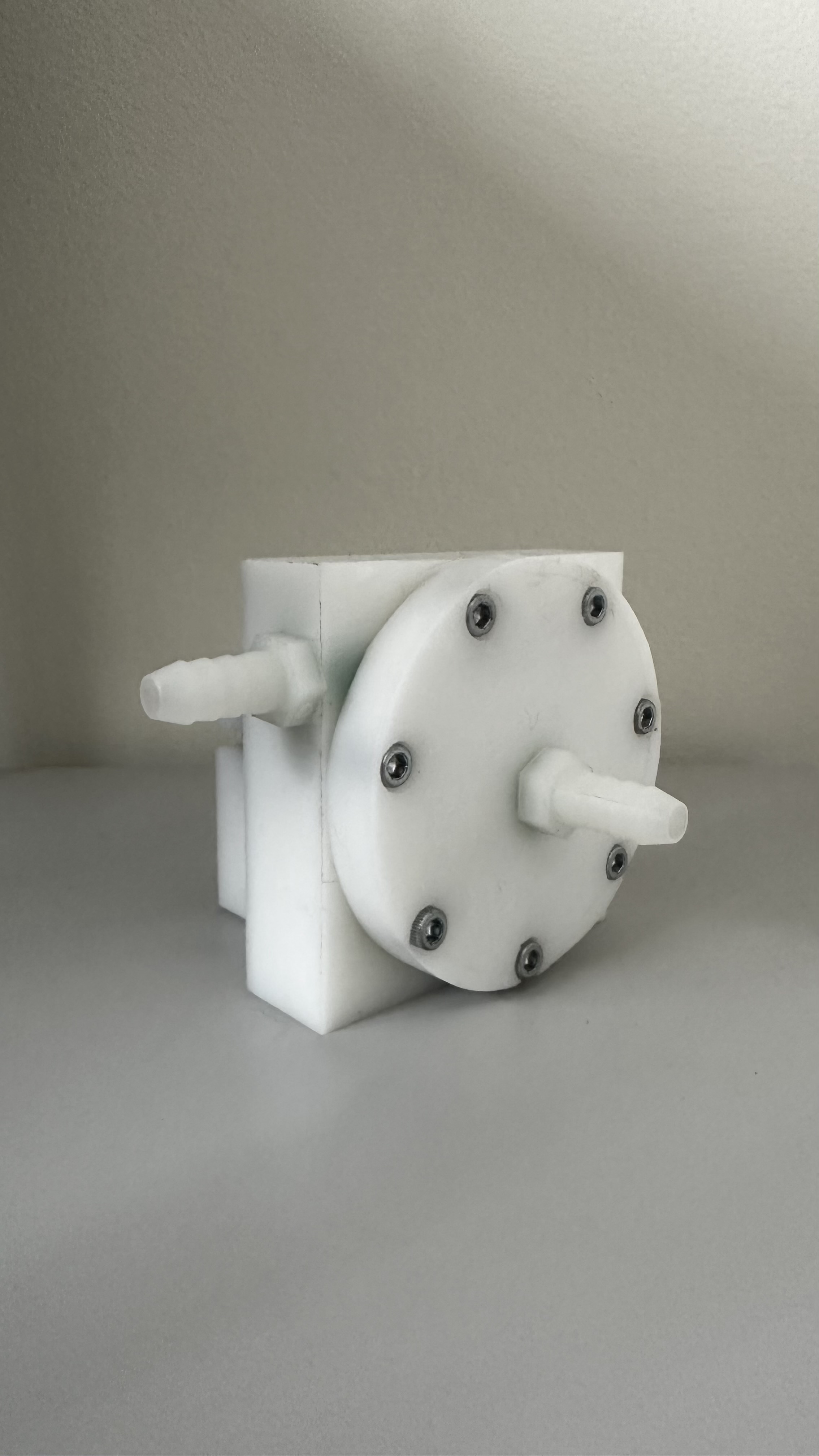 Three quarter view showing the completed housing and hose connection geometry.